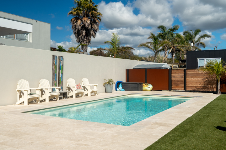 Safe and stylish Compass Sanctuary fibreglass pool installed in a modern New Zealand backyard